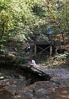 Waterfall and wooden bridge