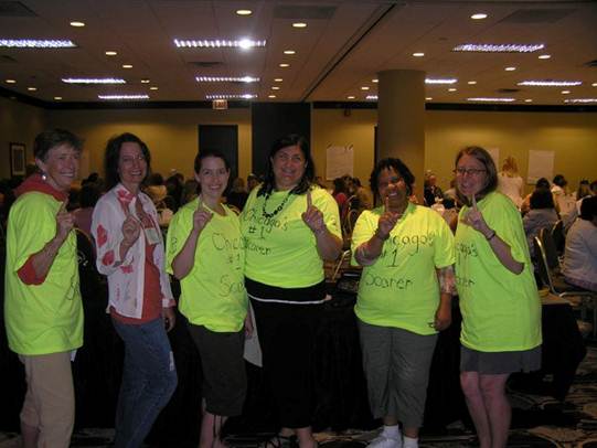 Teachers in neon yellow t-shirts that say Chicago's number one scorer
