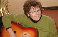 Woman with acoustic guitar