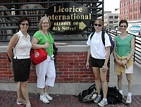 Group in front of a haymarket sign