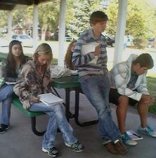 Students writing outdoors awt Centennial Hall