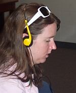 Woman listening through headphones