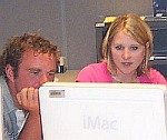 Two people at a computer