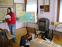 Students writing in a old Centennial Hall classroom