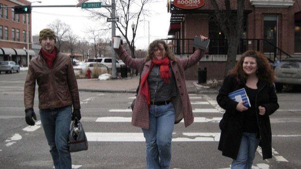 Teacher-writers cross a street during a winter writing marathon